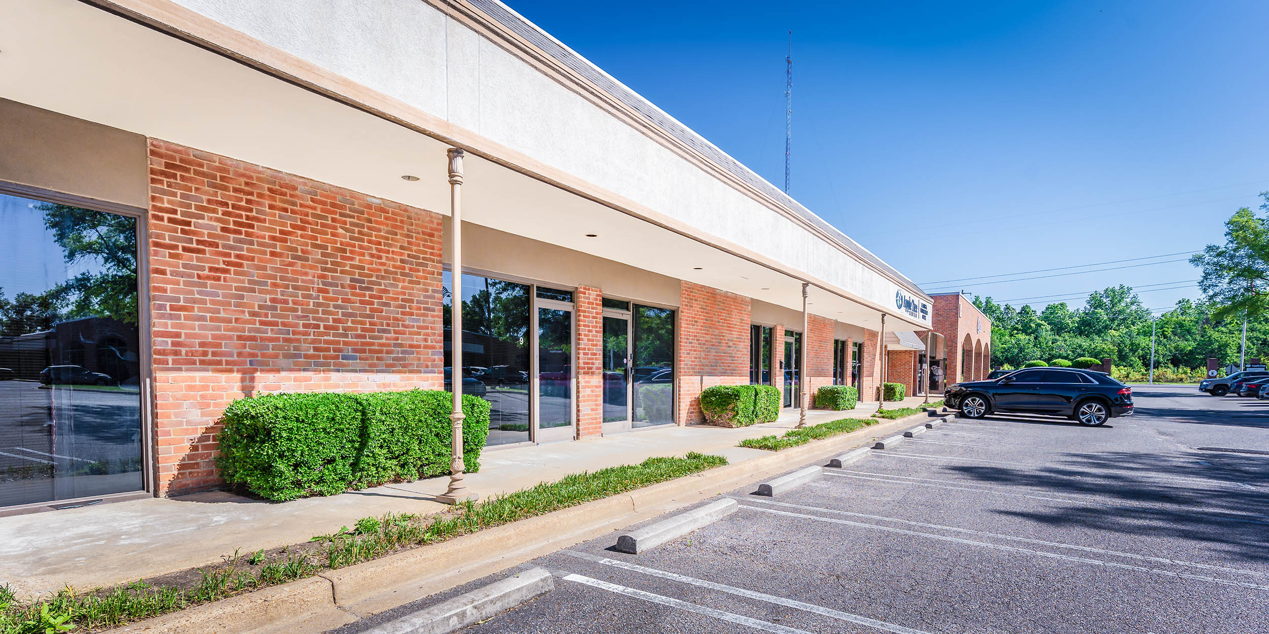 Brick commercial suites with landscaped entrances and convenient front-door parking